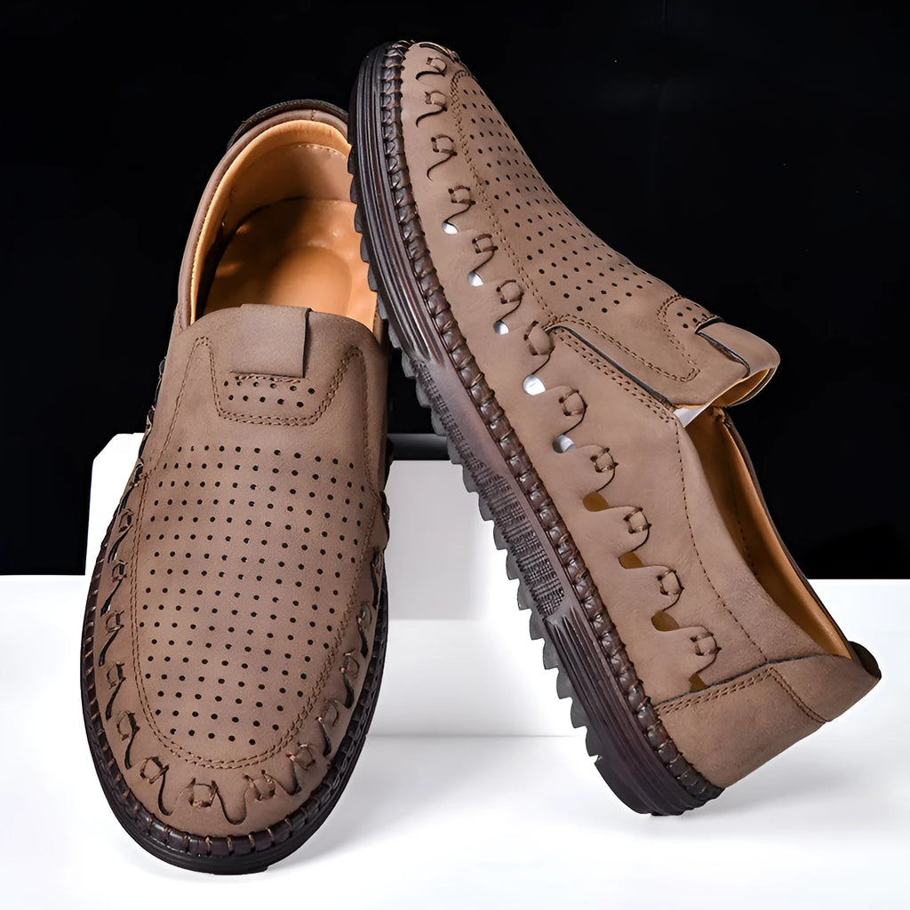 Men's brown casual slip-on leather shoes with round toe and flat sole.
