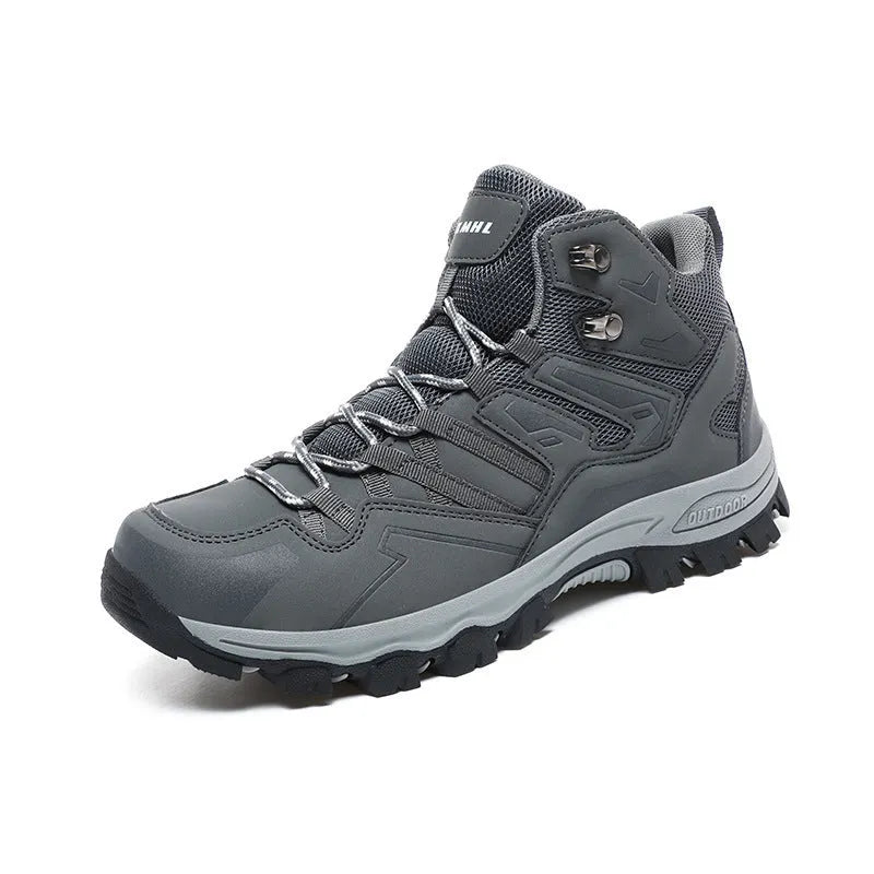 A pair of low-top hiking sneakers with a flannel upper and rubber sole, shown on a rocky mountain path.