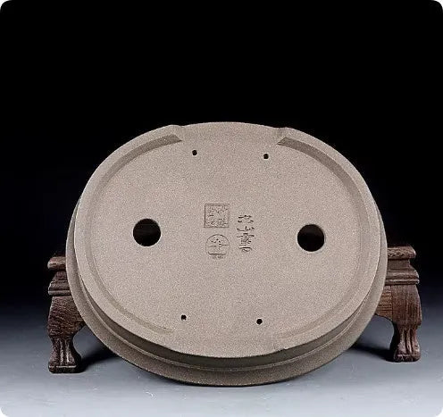 Handmade antique oval purple sand bonsai pot with dimensions 25x21x6.3 cm.