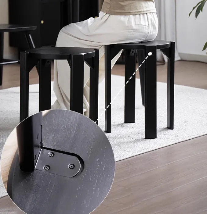 Stackable iron dining stool with round seat and metal frame in modern design