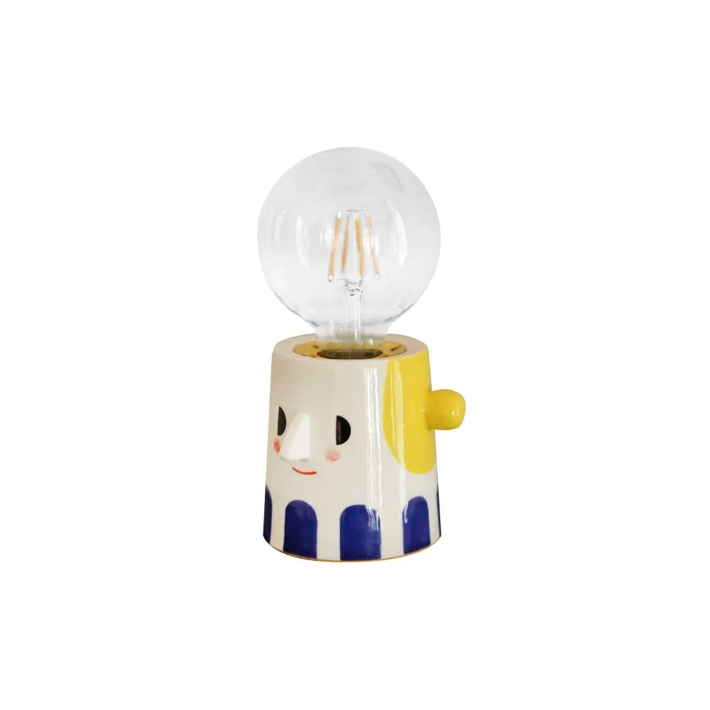 Handmade ceramic bedside lamp with ball headlight colour on wooden table