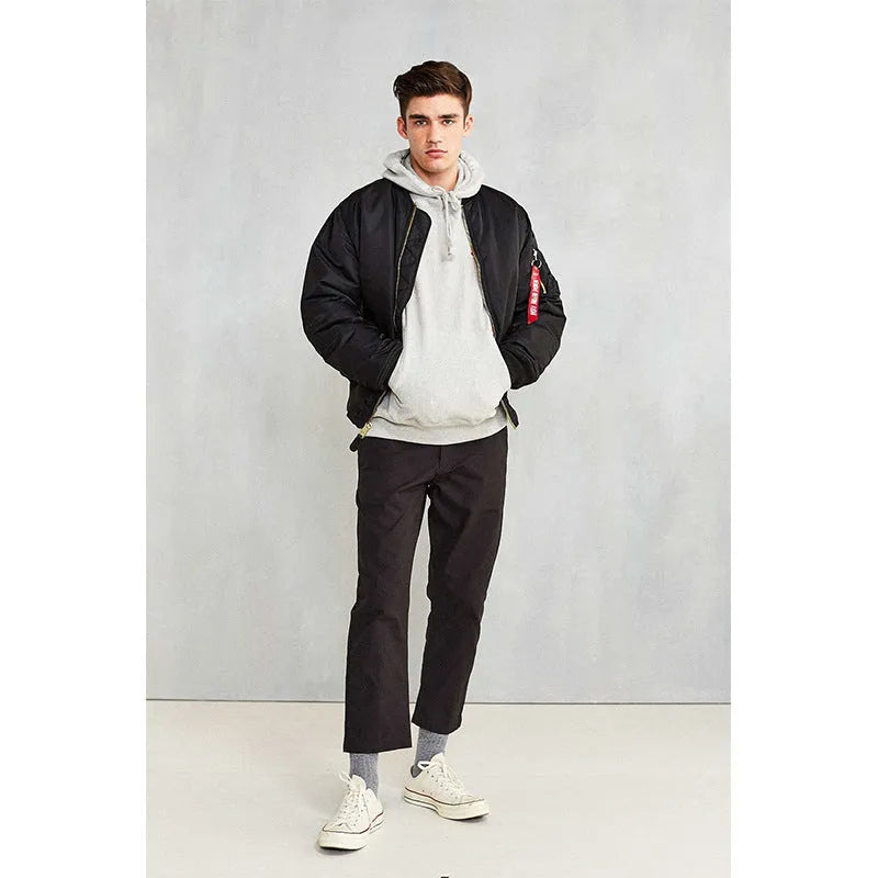 Men's loose-fit Army Green cotton-padded pilot jacket with wear-resistant nylon fabric on a hanger.