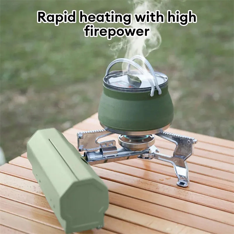 Green portable folding gas stove with serrated pot support and adjustable valve, shown with storage bag.