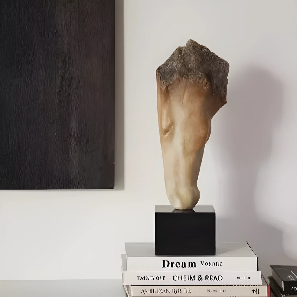 Carved abstract horse head sculpture in retro French style on a desktop.