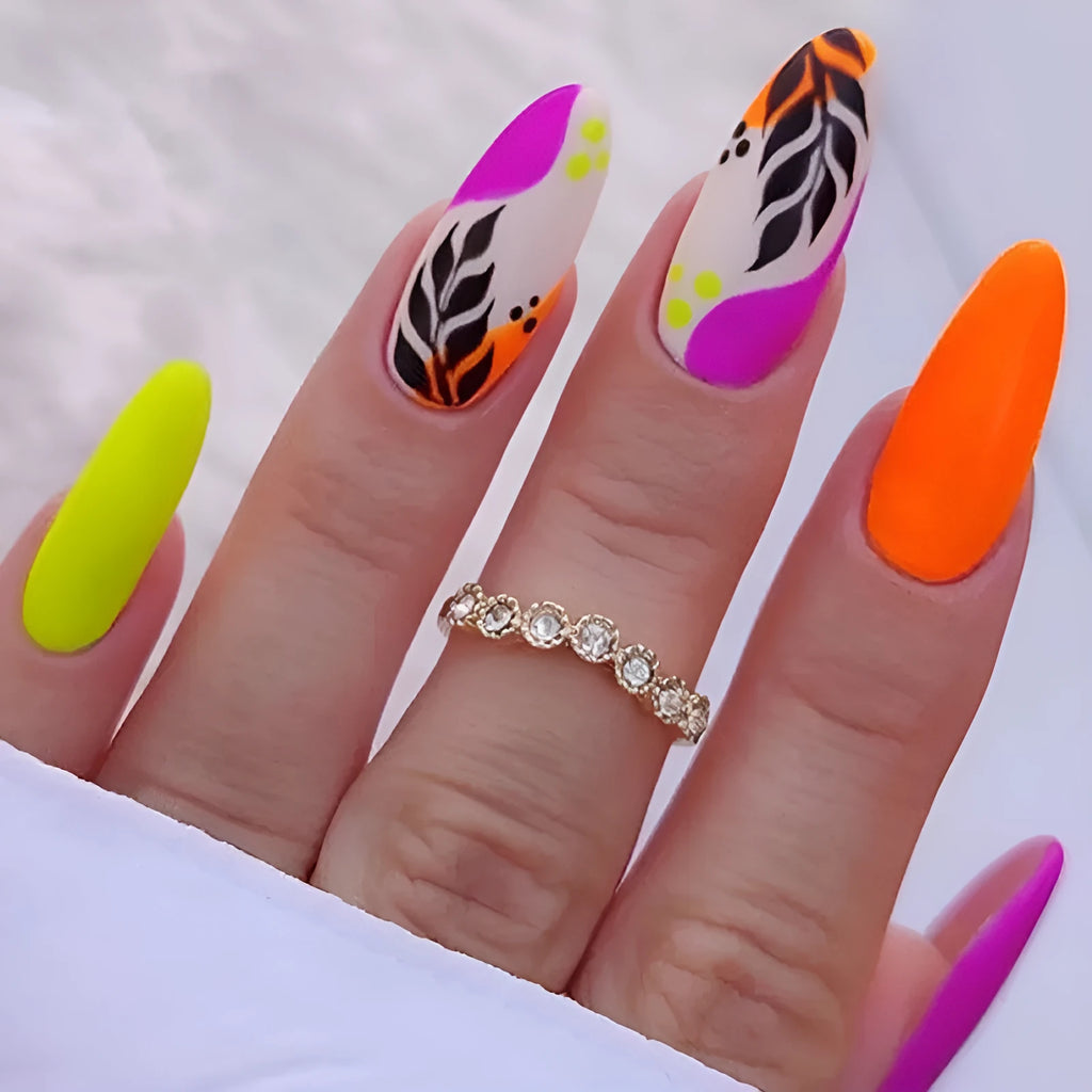 Wear Armour medium almond frosted nail stickers showing four designs: colourful leaves, leopard print, macarons, and plating.