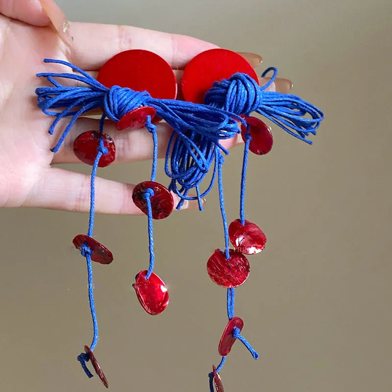 Women's geometric cloth earrings with silver needle and blue resin flower decorative details