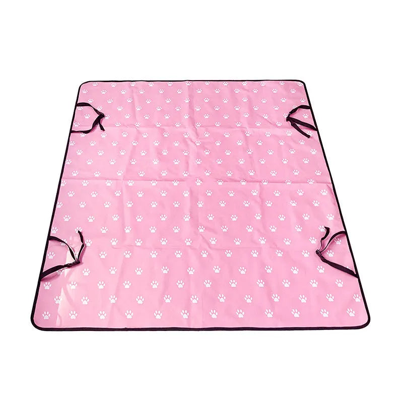 Grey dog bone print water resistant car pet mat measuring 140x110cm on a car rear seat.