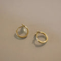 Gold plated sterling silver fishtail earrings with smooth finish and 8-10mm diameter.
