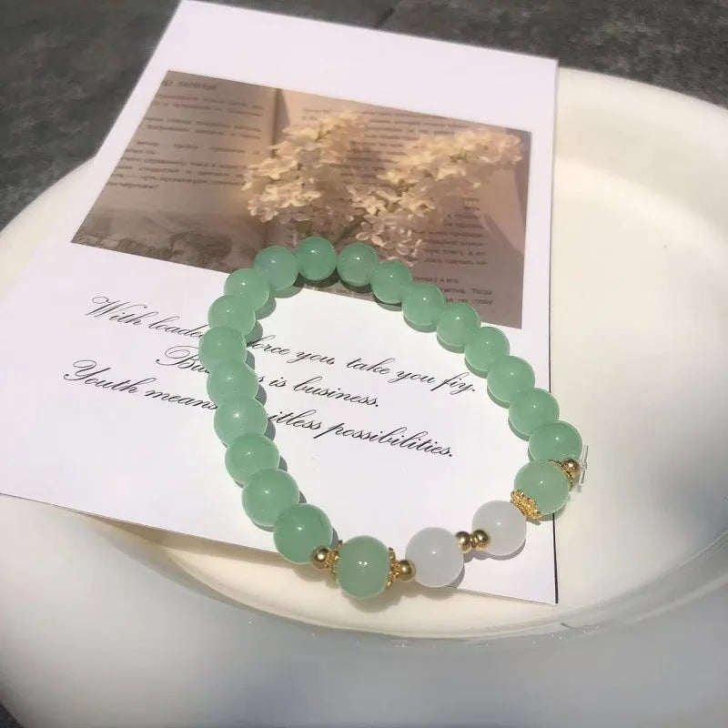 Chinese style bamboo leaf glass bracelet for women with a bamboo joint design.