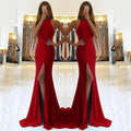 Red long knit evening dress with hollow bust detail and a flowing high-waisted swing skirt on a model.