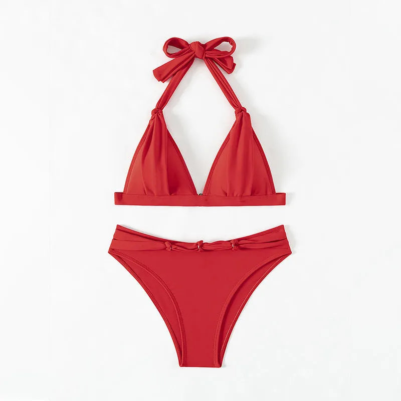 Red women's lace-up halterneck bikini set with split beach design for swimming