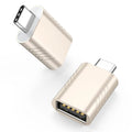 Zinc alloy USB data and charging converter adapter in champagne gold colour on a white background.