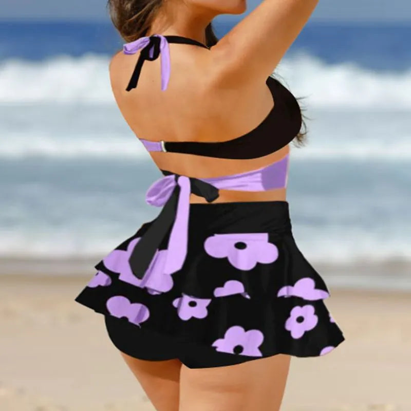 Women's purple high waist lace-up bikini swimsuit set with matching skirt on a white background.