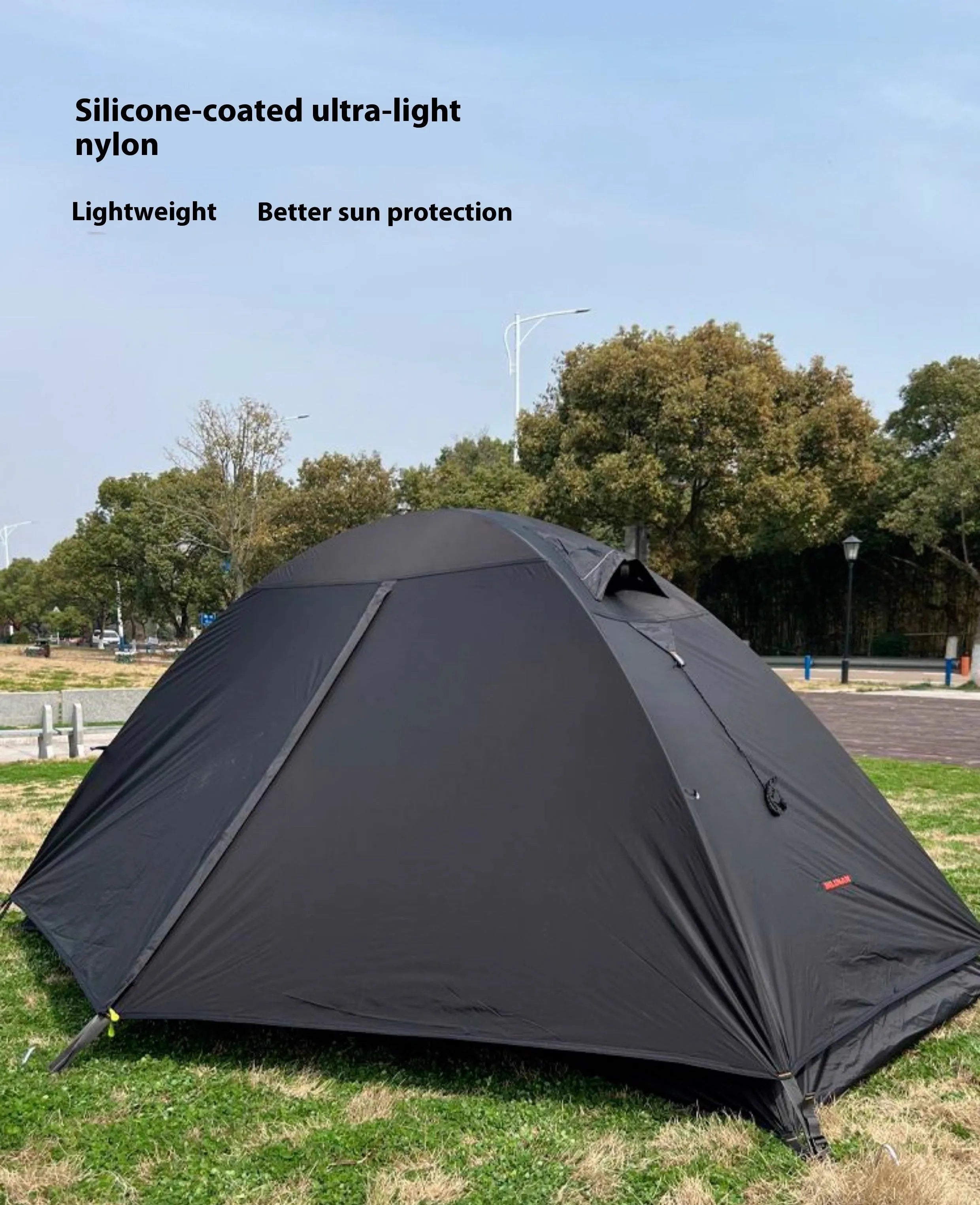 Single person tent with aluminium poles in black colour showing double account structure and mesh ventilation panels
