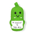 Green pickle-shaped squeaky dog chew toy with textured nubs for dental cleaning
