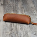 Black handmade cowhide leather pencil case with zipper, showing square 18cm design.