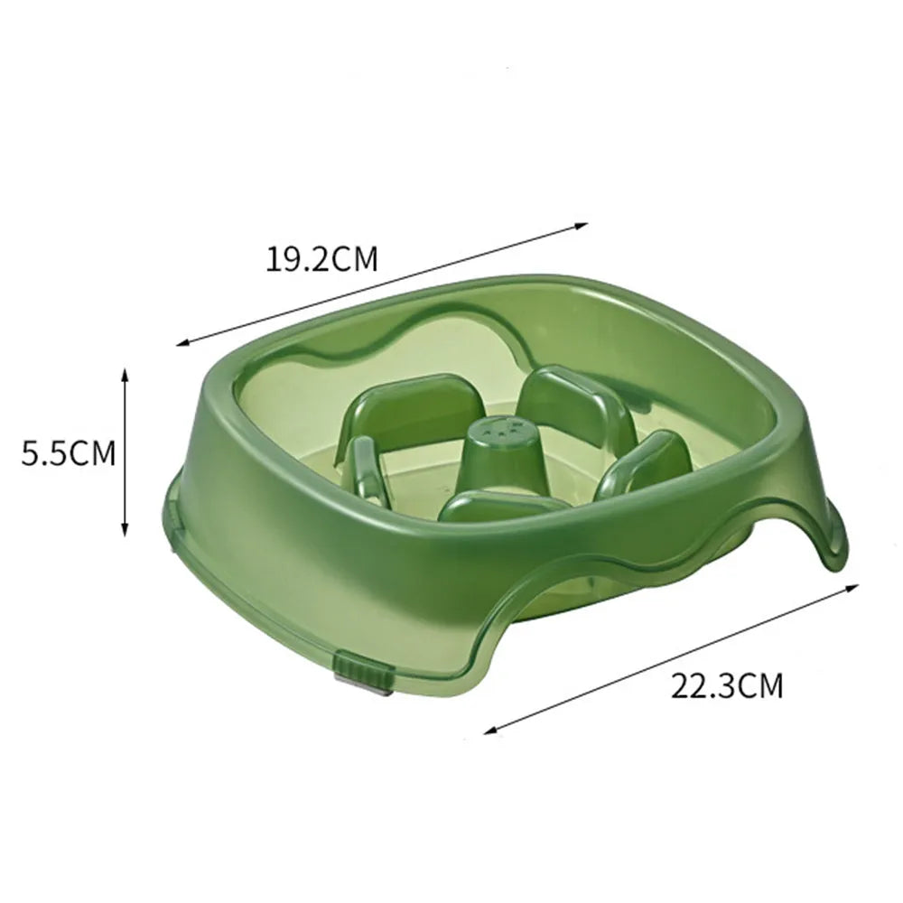 Blue plastic slow feeder dog bowl with anti-choking design on a white surface.