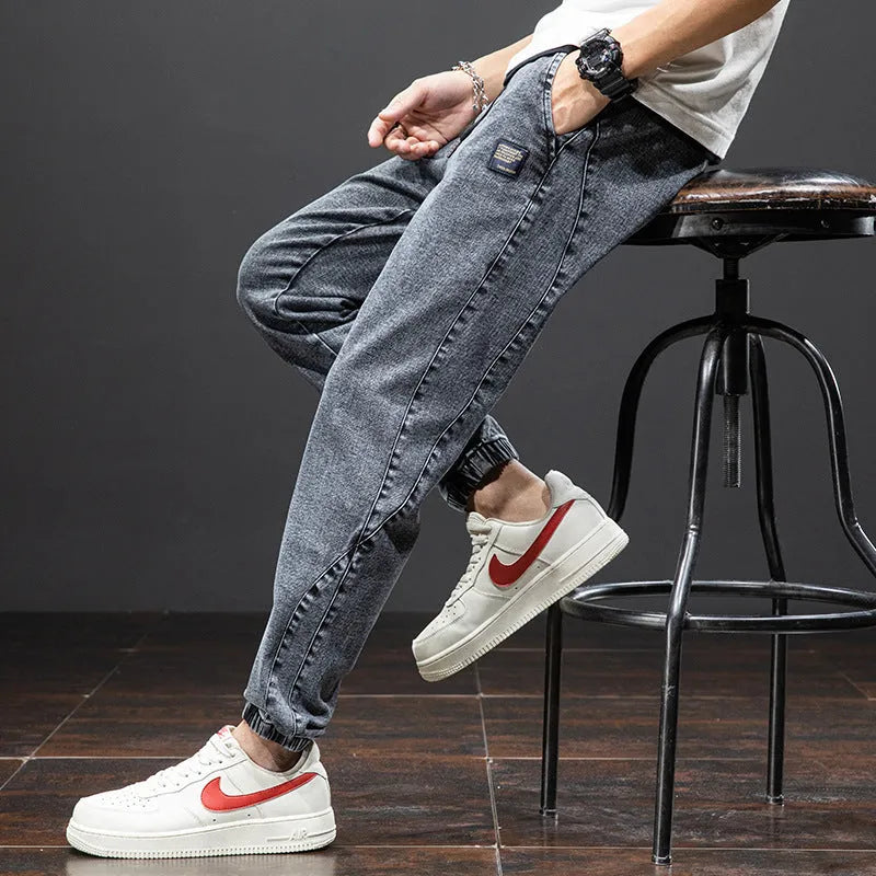 Men's loose fit cargo jeans in Korean style, showing straight leg and mid-waist design.