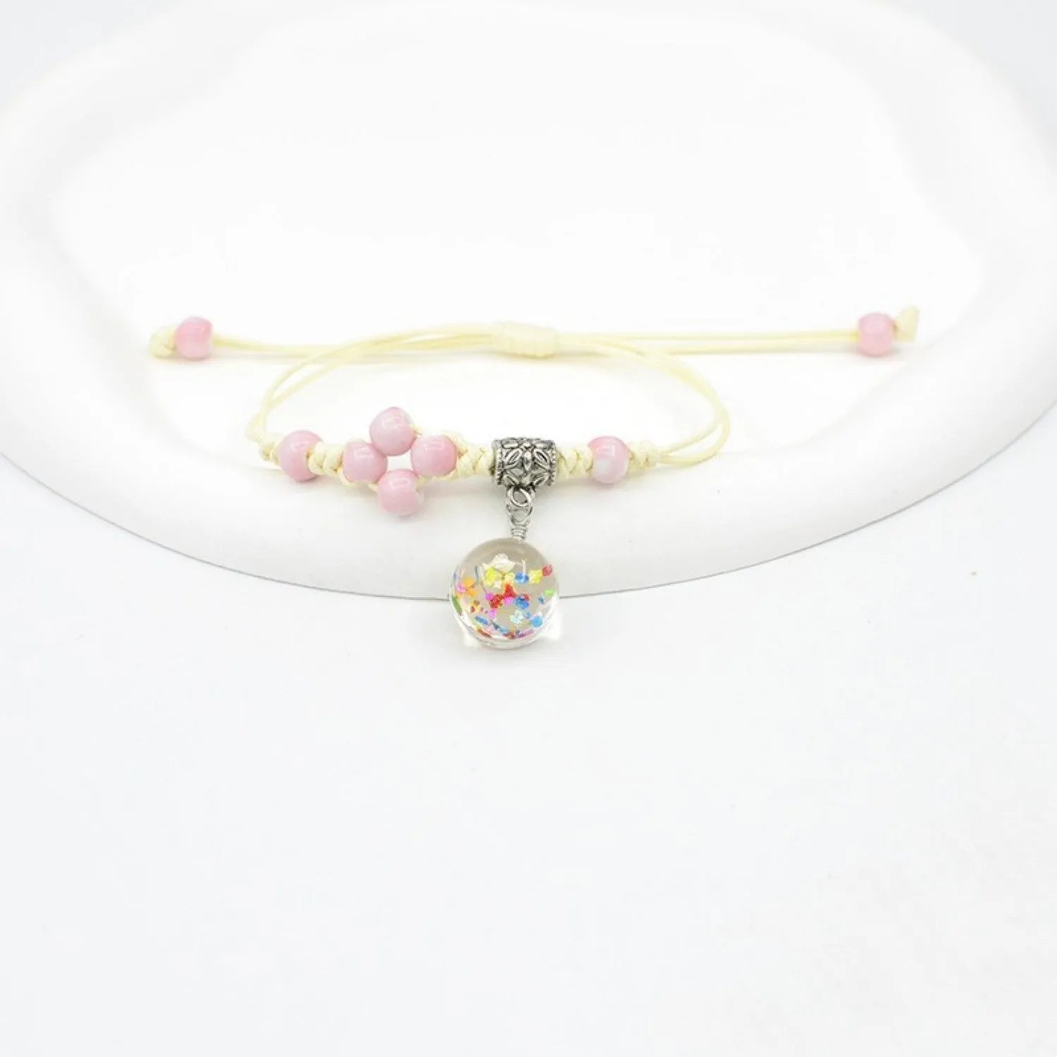 Glass bracelet with dried flowers inside 1.4cm beads on lace-style band in multiple colour options