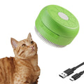 Green rechargeable cat steam brush with silicone bristles on a white background.