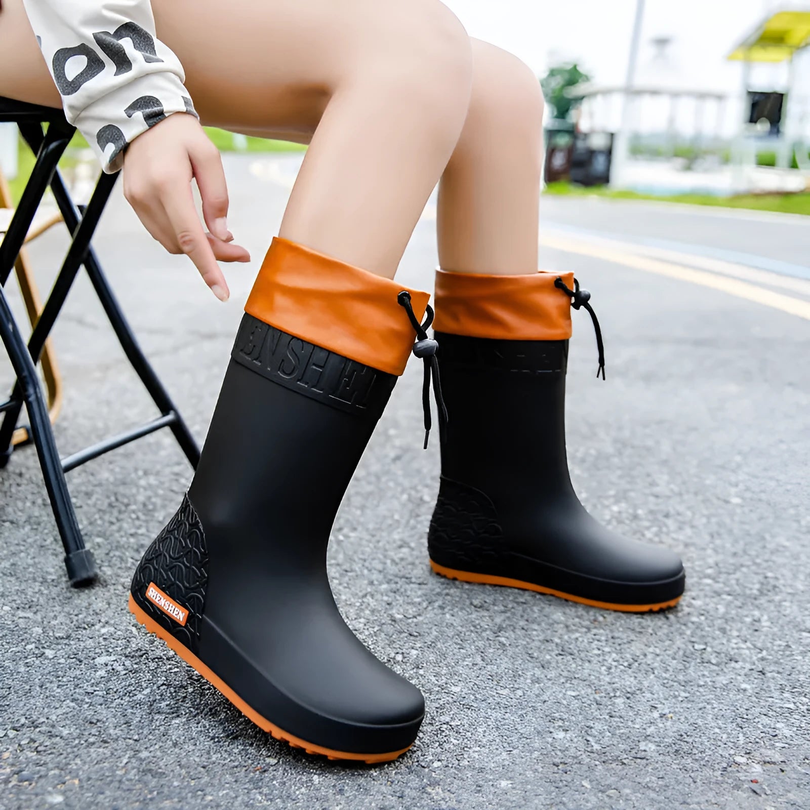Women's PVC rain boots with non-slip soles in apricot, black, brown, and pink colour options