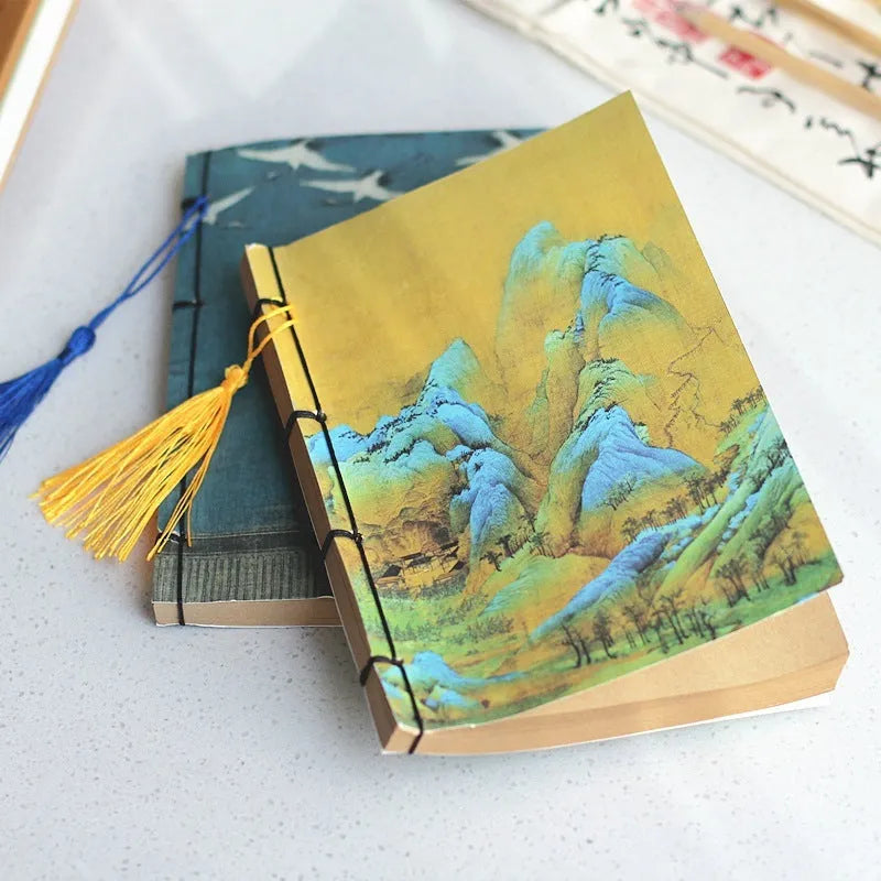 A5 antique art notebook with wire binding, decorative tassels, and traditional Chinese painting cover design