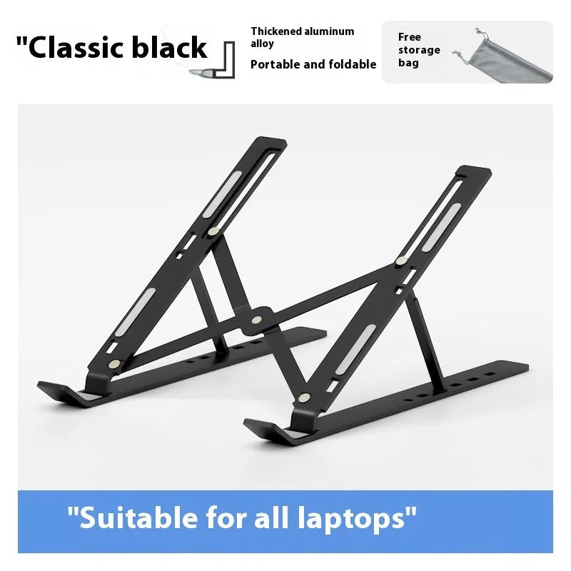Silver aluminium alloy folding laptop stand with black silicone pads on a wooden desk.