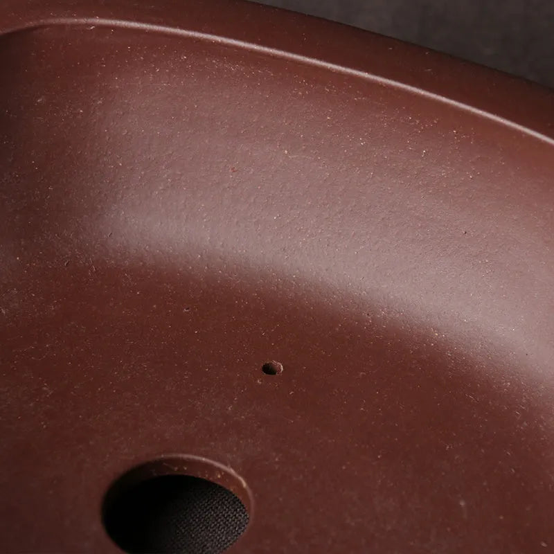 Handmade purple clay bonsai basin in plain Chinese style, shallow rectangular shape.
