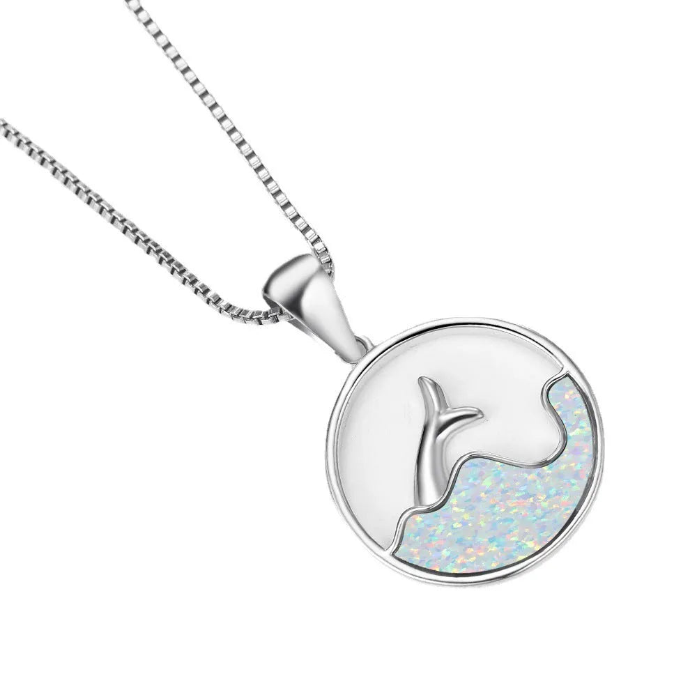 White gold electroplated copper necklace with geometric sea fishtail pendant in blue opal colour.