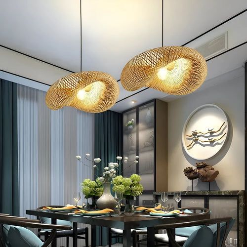 Woven bamboo straw hat-shaped hanging chandelier lamp showing natural texture and light diffusion.