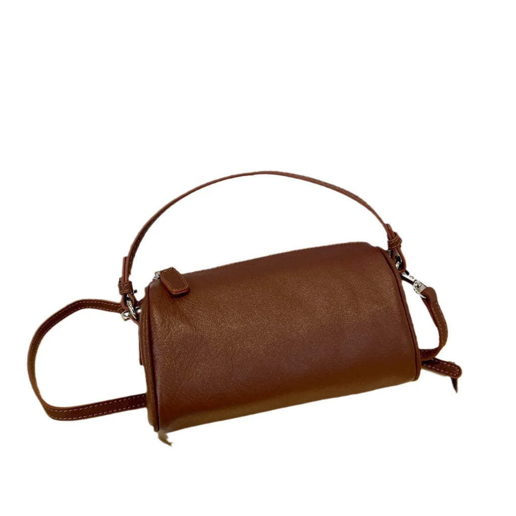Genuine leather cylindrical crossbody phone bag in vegetable-tanned leather with single shoulder strap
