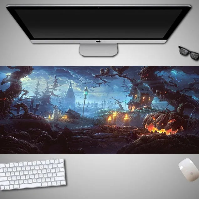 Oversized Halloween-themed gaming mouse pad with non-slip base on a desk.