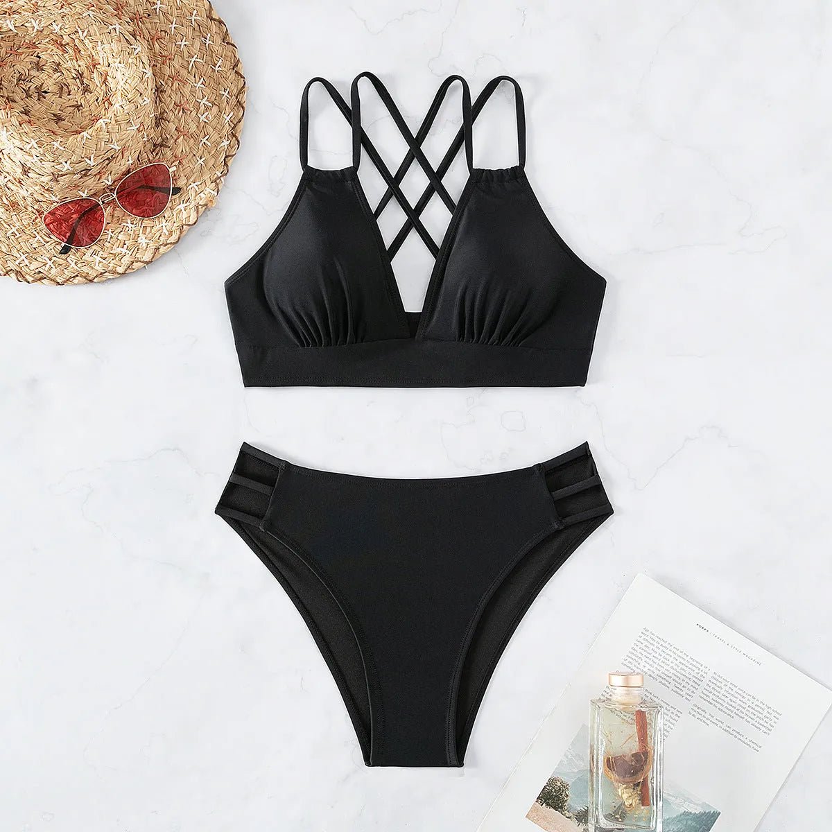 Women's black V-neck halter bikini swimsuit with matching shorts on a mannequin