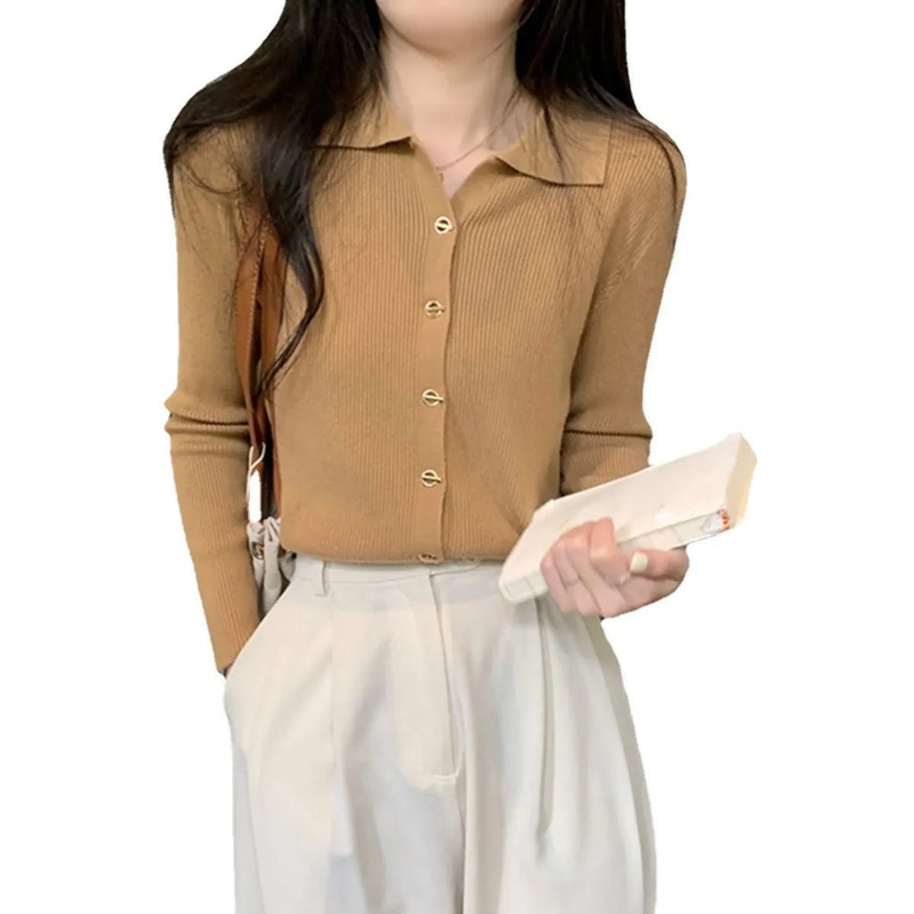 Beige loose fit long-sleeved viscose knitted cardigan top on a hanger.