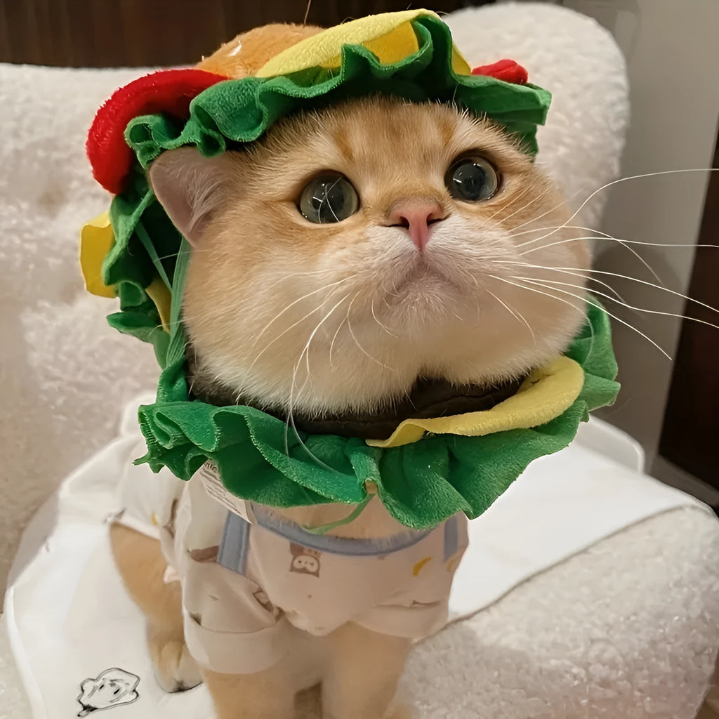Burger-themed plush headdress collar for cats on a white background, showing adjustable strap and cartoon bun detailing.
