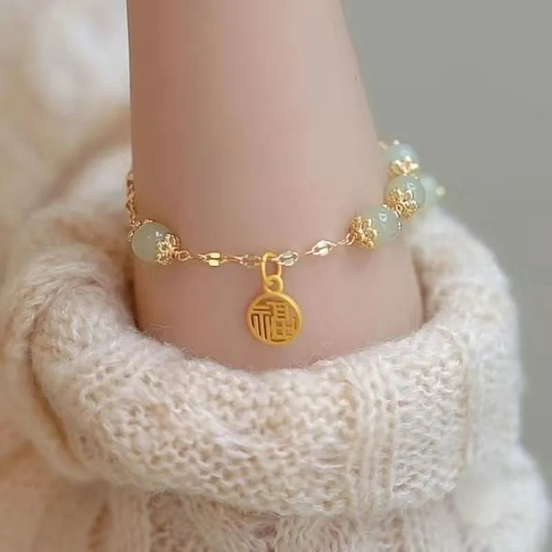 Chinese style bamboo leaf glass bracelet for women with a bamboo joint design.