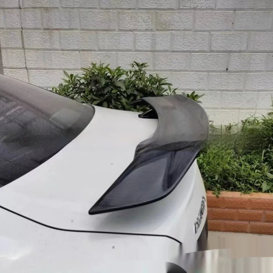 Universal punch-free ABS plastic car spoiler tail wing in bright black finish.