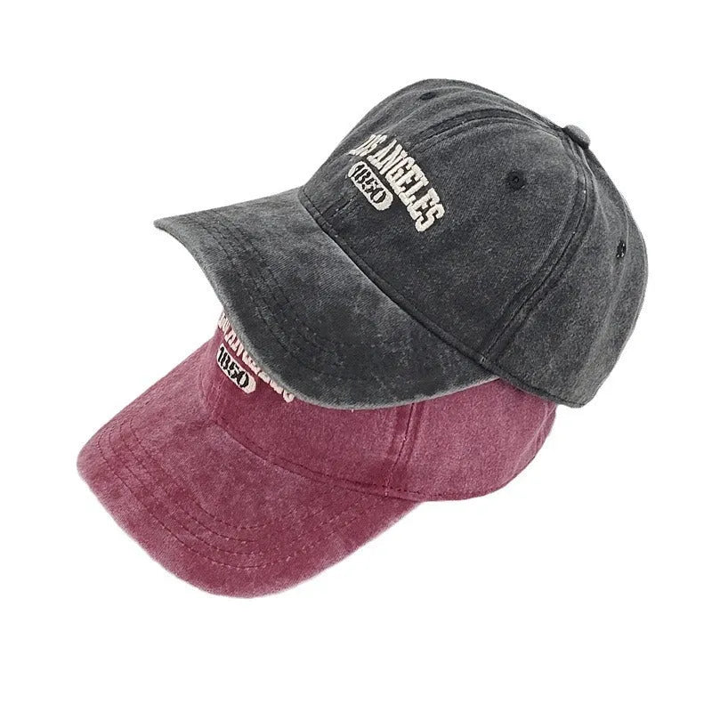 Retro peaked cap with distressed letter embroidery in beige colour with adjustable strap and conical crown