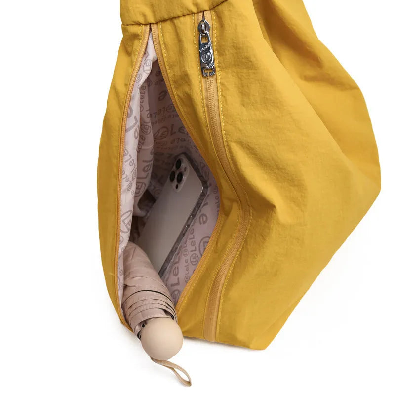 Women's heart-shaped nylon underarm bag in black, yellow, khaki, and blue colour options showing large capacity design