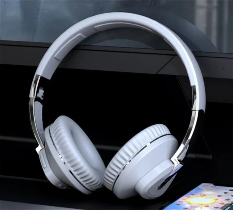 Wireless Bluetooth headset in black colour showing ear cushions with AUX audio jack and control buttons