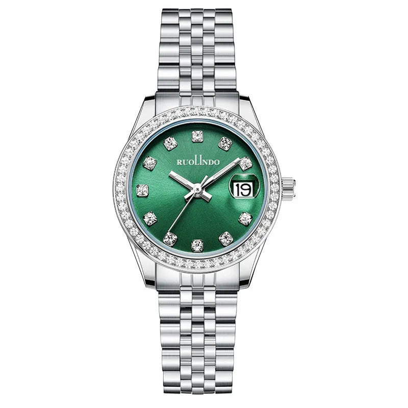 Women's silver alloy quartz calendar watch with circular dial and stainless steel folding buckle on wrist.