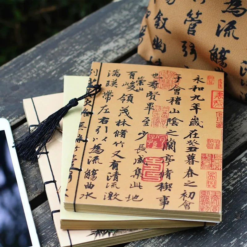 A5 antique art notebook with wire binding, decorative tassels, and traditional Chinese painting cover design