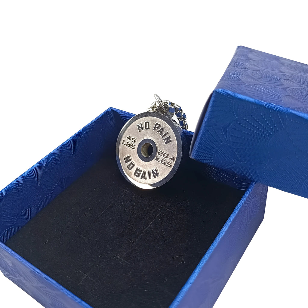 Polished stainless steel barbell disk pendant on a 60cm chain, a fitness-inspired geometric necklace.