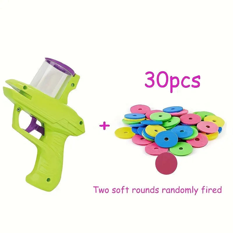 Interactive plastic cat toy launcher with foam disc projectile in green or purple colours