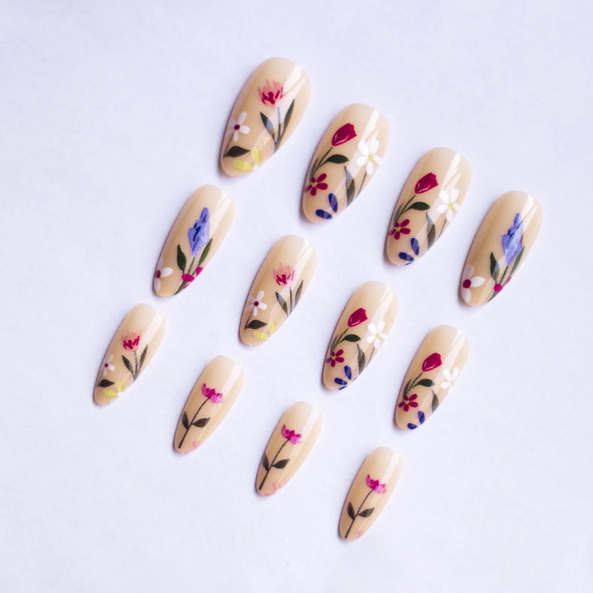 Almond-shaped press-on nails with European floral wear armour rose tulip patterns