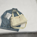 Large capacity polyester canvas shoulder tote bag in solid colour with phone compartment
