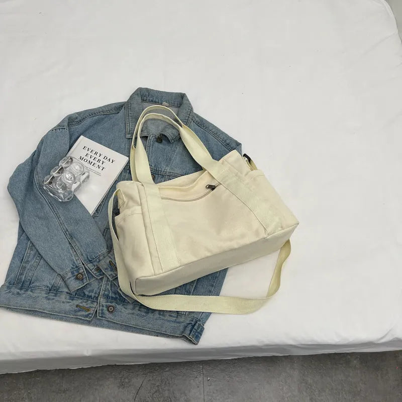 Large capacity polyester canvas shoulder tote bag in solid colour with phone compartment