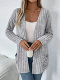 Solid colour long sleeve cardigan with front pockets in loose oversized fit