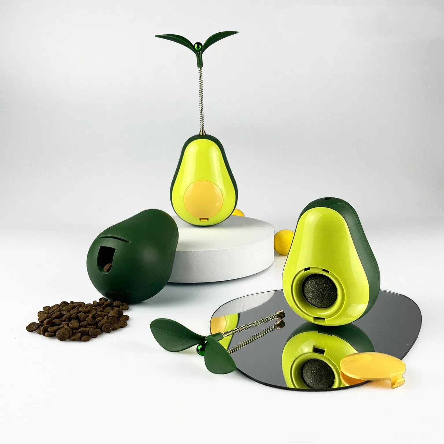 Green avocado-shaped silicone food leakage cat toy tumbler on a surface, 80x80x107mm
