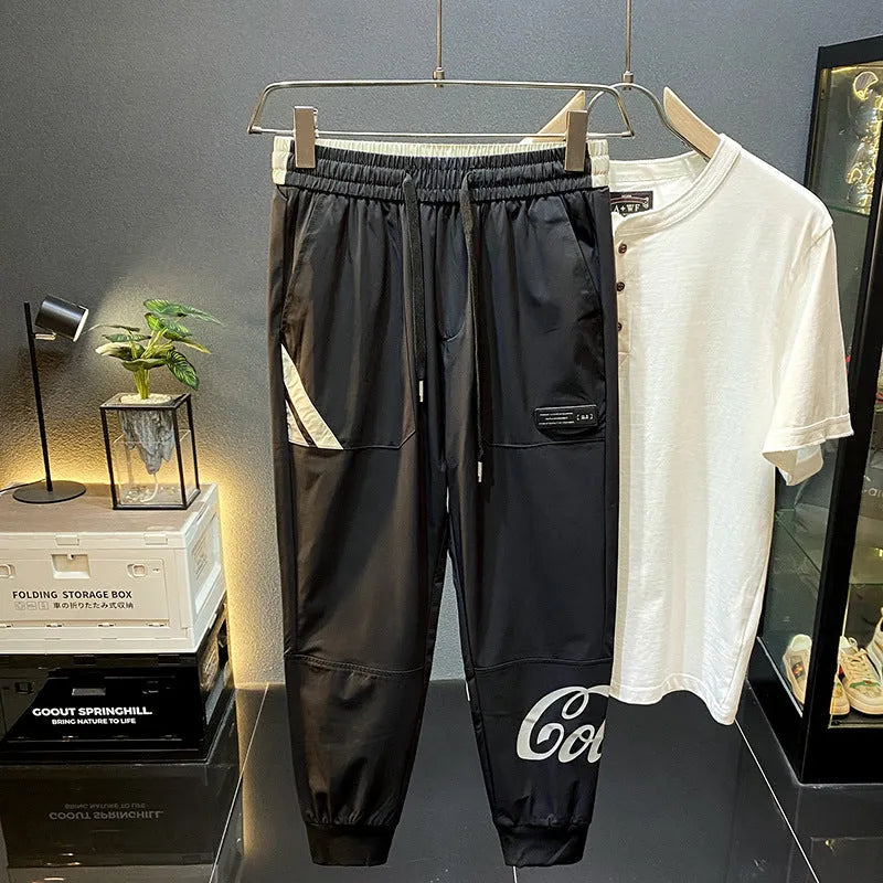 Black men's casual cropped trousers with banded ankle, made from ultra-thin ice silk cotton fabric.
